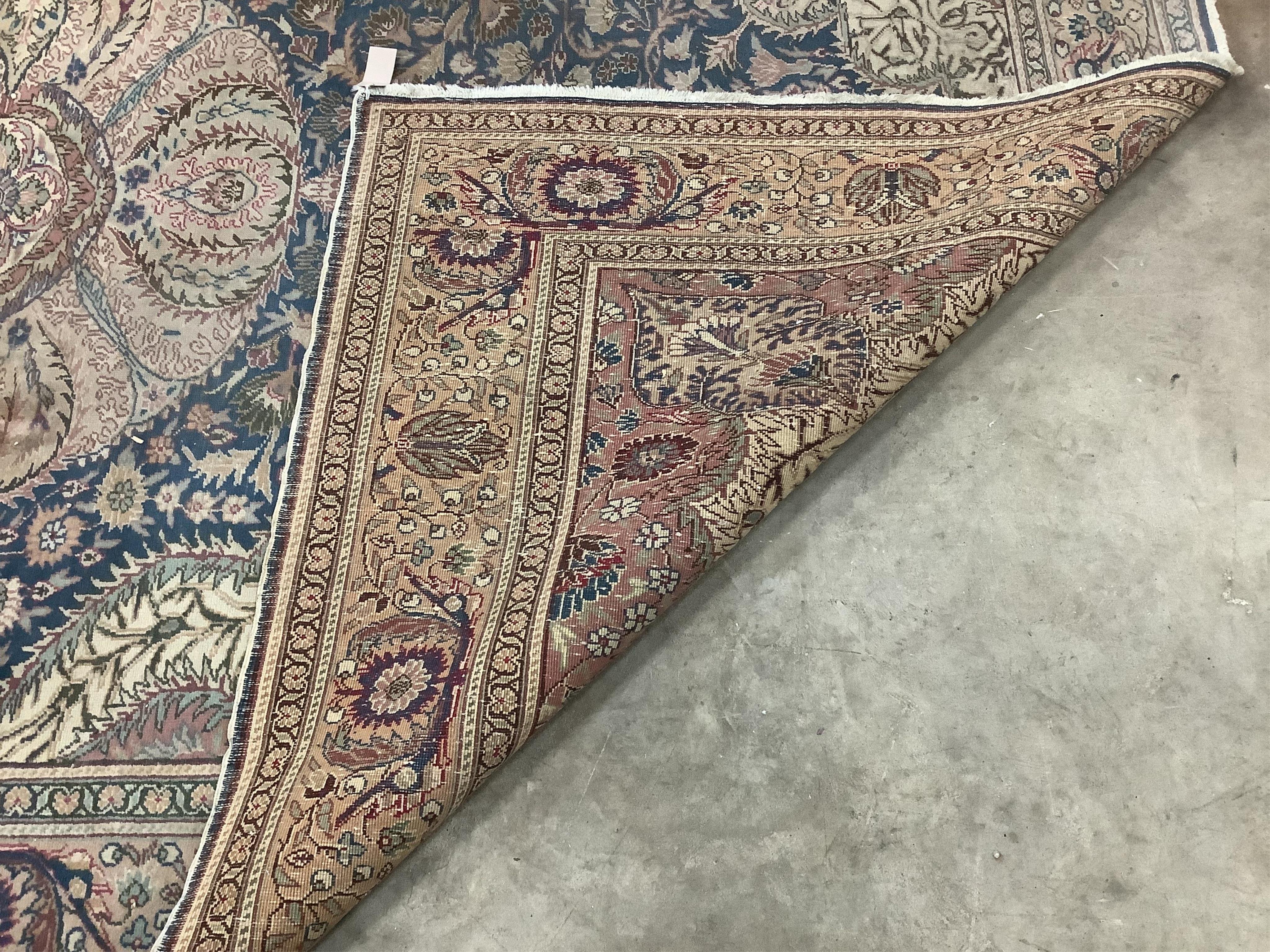 A North West Persian ivory ground carpet, 290 x 200cm. Condition - poor to fair